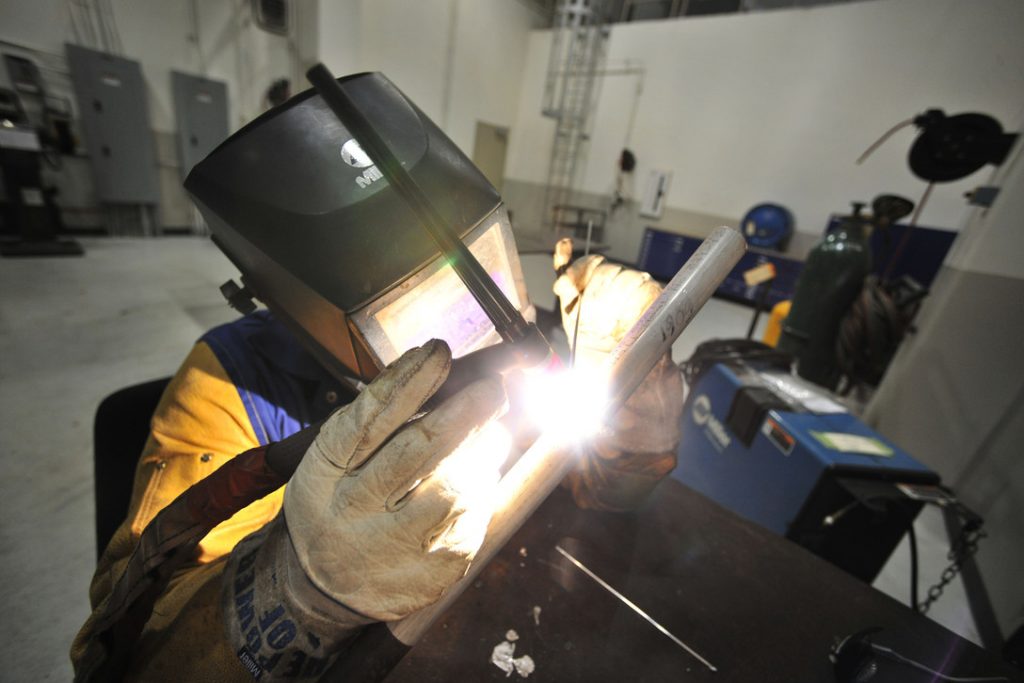 A welder in work with aluminum