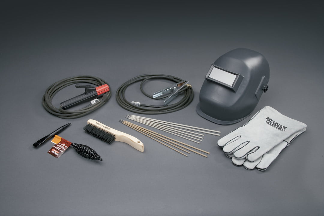 Welding accessories and gear on the grey surface