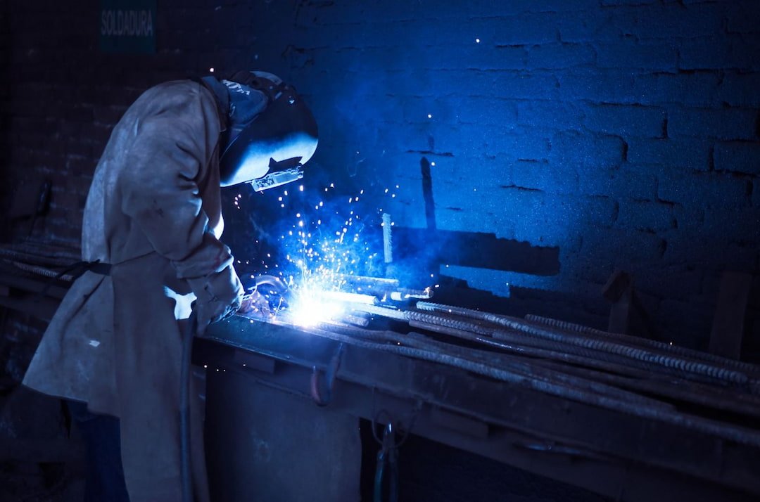 a welder with safety gear working