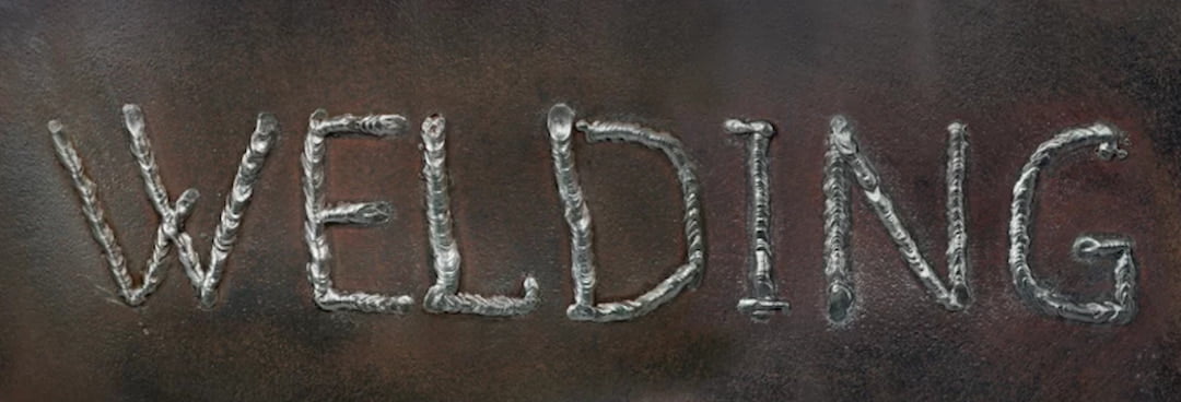 welds creating the word WELDING