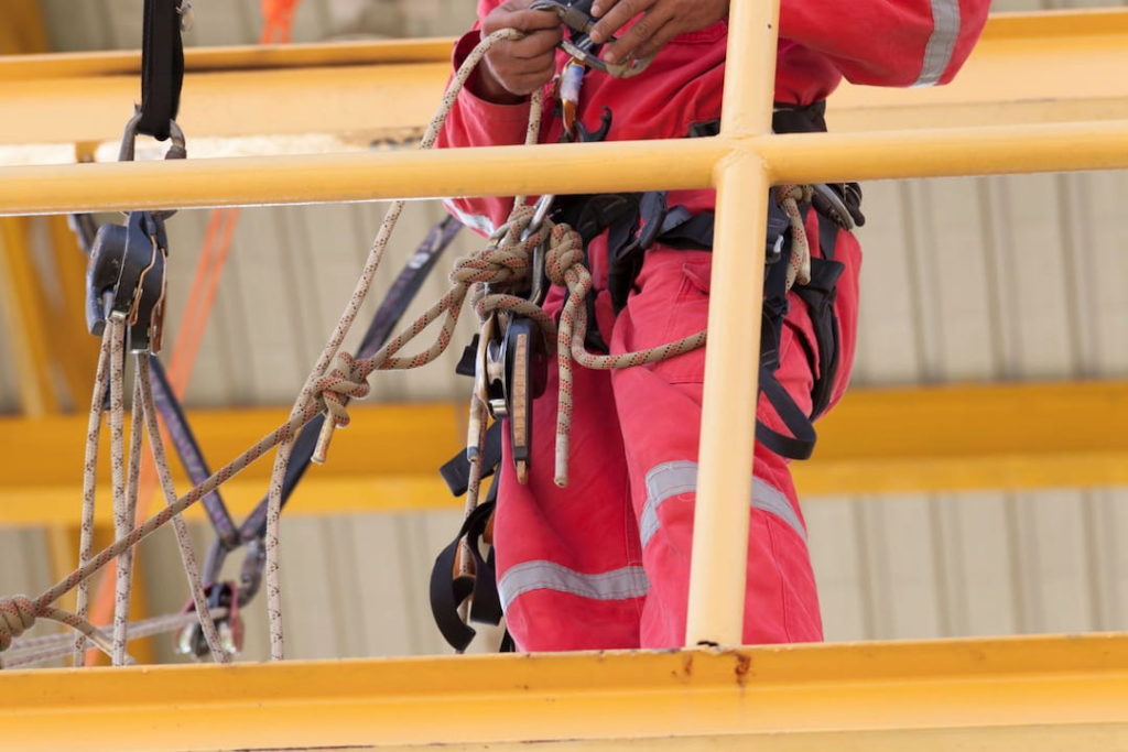 A rope access welder getting ready for work