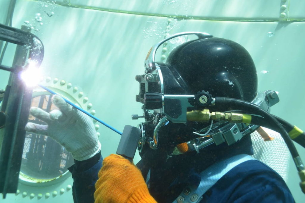 An underwater welder at work