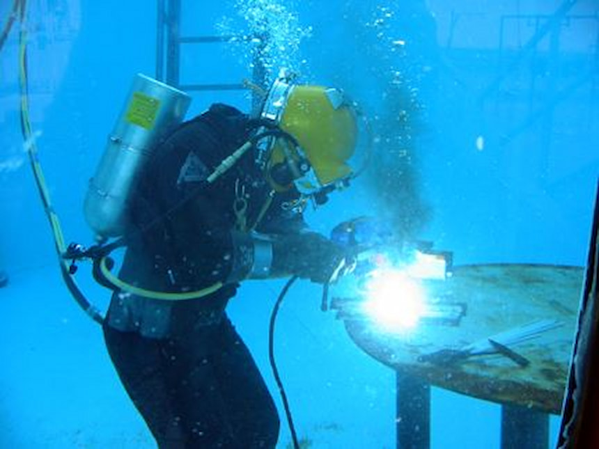 A welder working under the water