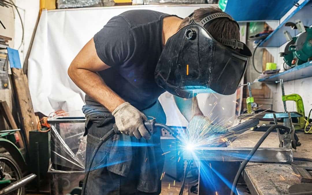 A person welding in the shop