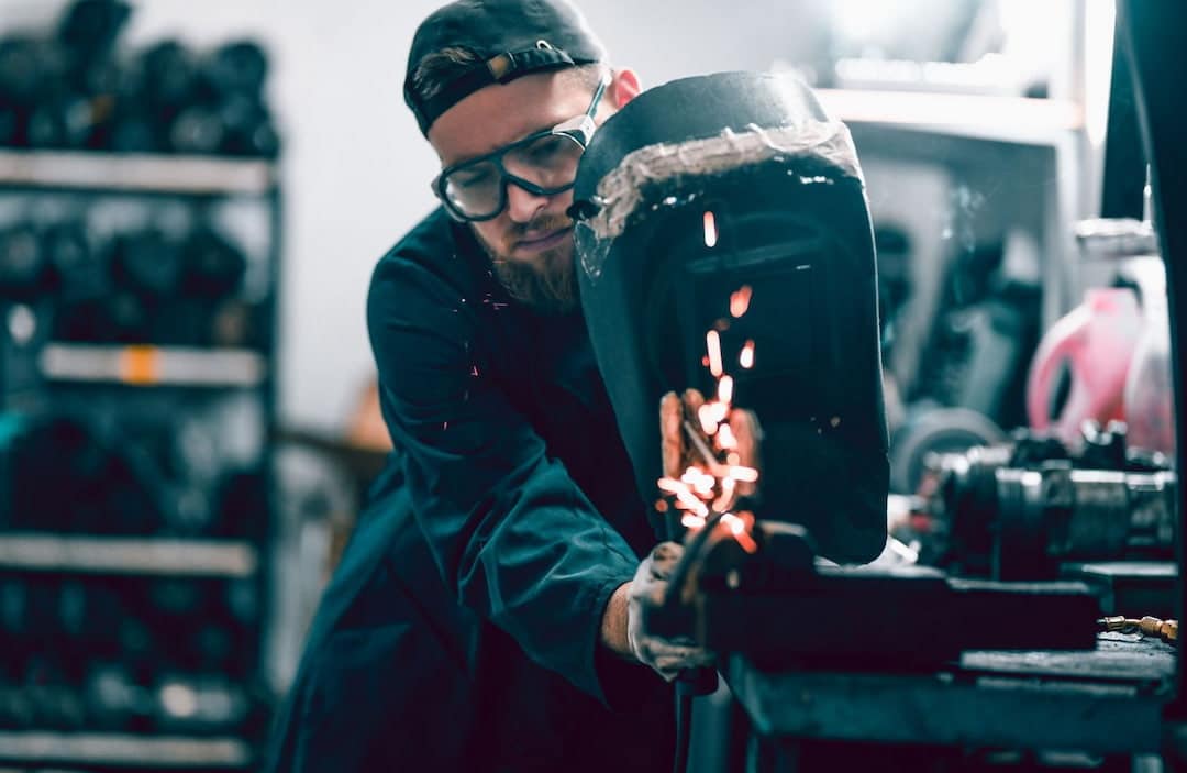 A person practicing welding